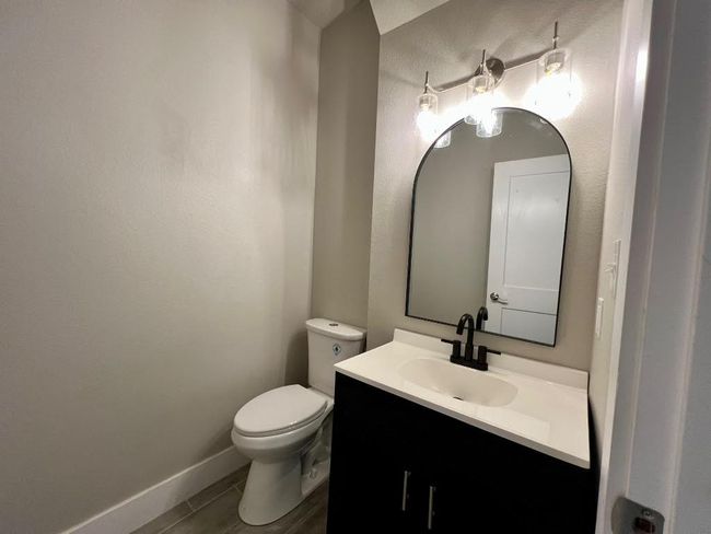 Half bath featuring vanity and toilet | Image 10