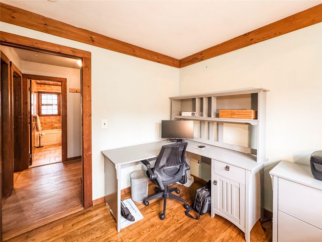 Office area with light wood-style flooring and baseboards | Image 18