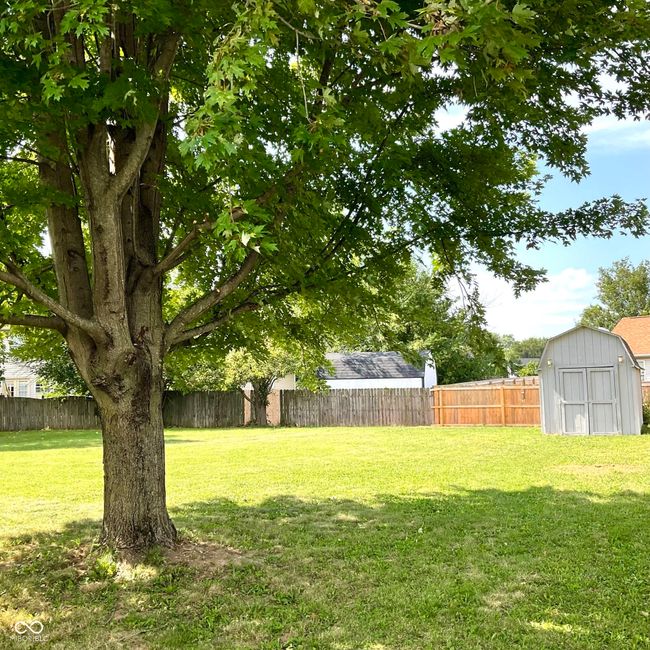 Back of home with massive fenced in private back yard. | Image 48