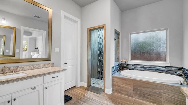 Bathroom featuring a tile shower, vanity, visible vents, and a garden tub | Image 12