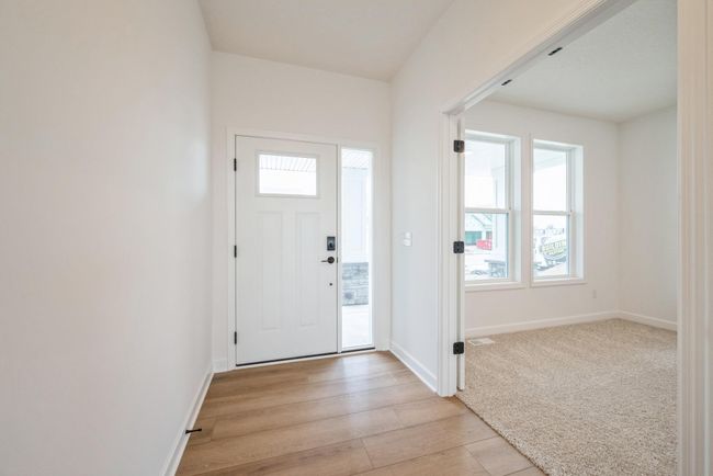 Photo is of the actual home. Make the best first impression with this bright and open foyer. | Image 6