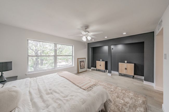 Bedroom with visible vents, baseboards, recessed lighting, light wood-style floors, and a ceiling fan | Image 16