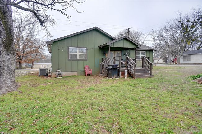 View of spacious back covered porch & back yard | Image 26