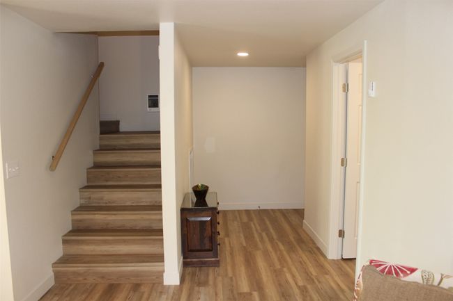 Stairs featuring wood finished floors and recessed lighting | Image 20