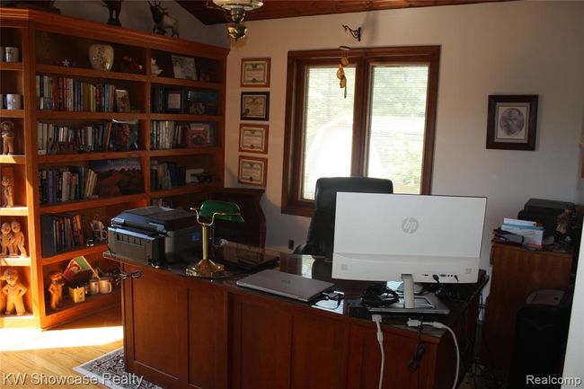 Loft area with private balcony to the left. Currently used as a work area. Make it your workout area, a lounge, or put up a wall and make a fourth bedroom. | Image 40