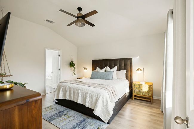 The spacious primary suite offers a peaceful place to unwind. | Image 12