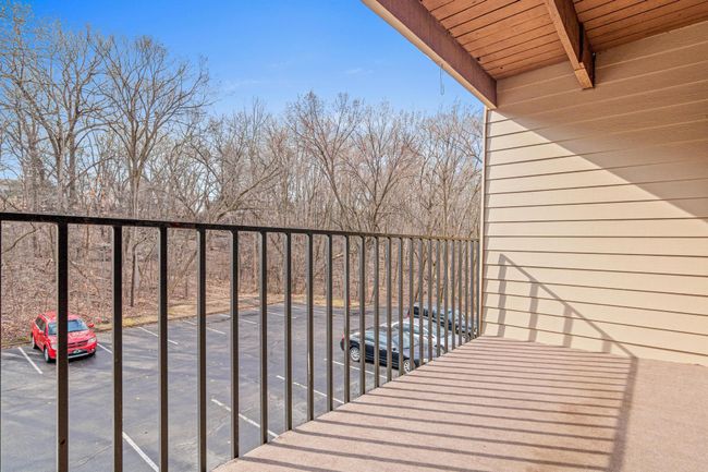 Balcony View Overlooking Scenic, Tree-Lined Woods | Image 19