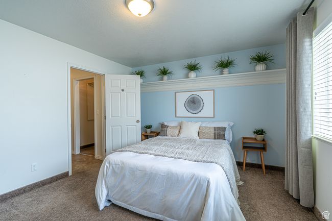 Bedroom with baseboards and carpet flooring | Image 15