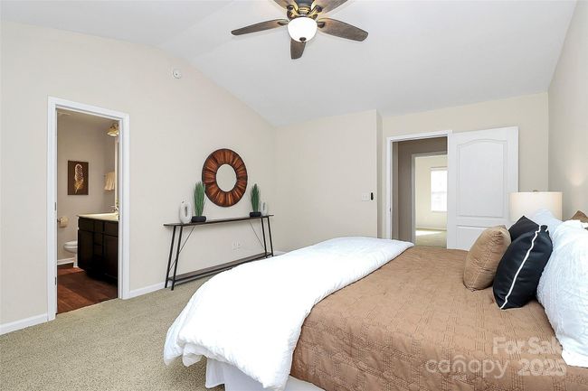 Large primary bedroom suite with gorgeous vaulted ceilings, facing private woods - new carpet & fresh paint! | Image 18