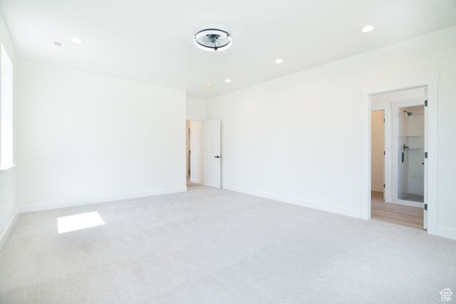 Empty room featuring light carpet and recessed lighting | Image 12