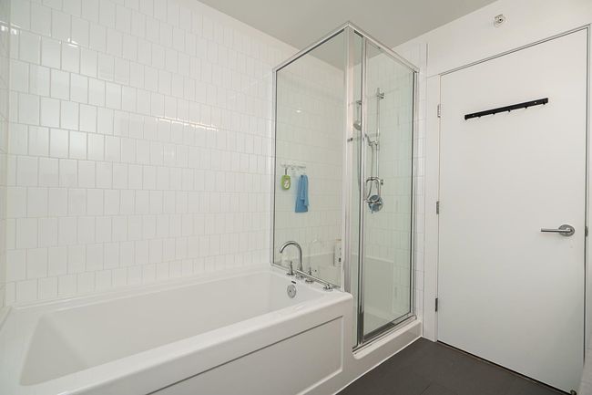 Bathroom with tile patterned floors, a shower stall, and a bath | Image 21