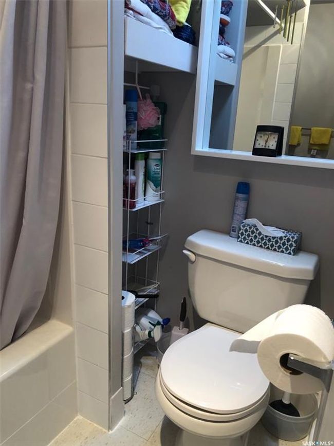 Bathroom featuring toilet and shower / tub combo with curtain | Image 33
