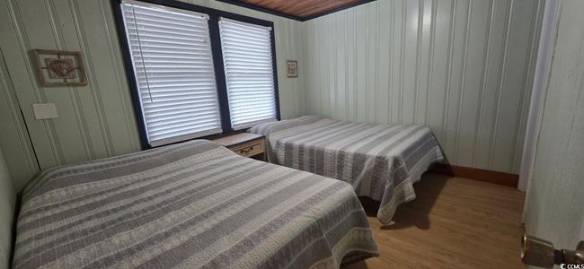 Bedroom with wood finished floors | Image 30