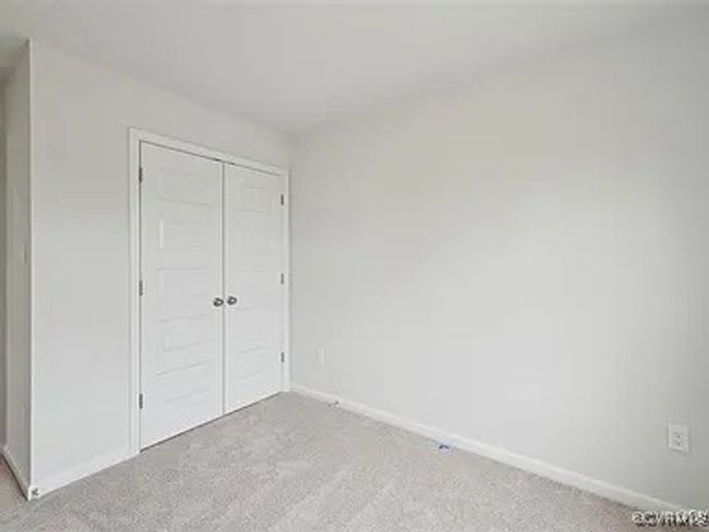 Unfurnished bedroom featuring light carpet and a closet | Image 22