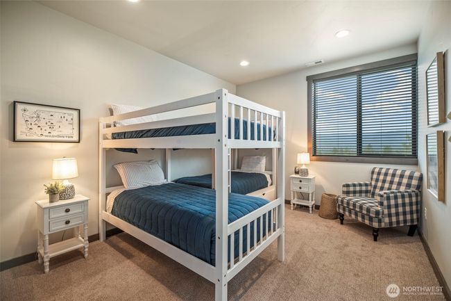 First bedroom you find upstairs is an adorable bunk room - cozy and sweet | Image 14