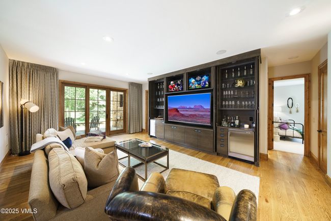 Remodeled Lower Level Family Room with 3 TVs and Full Wet Bar. | Image 10
