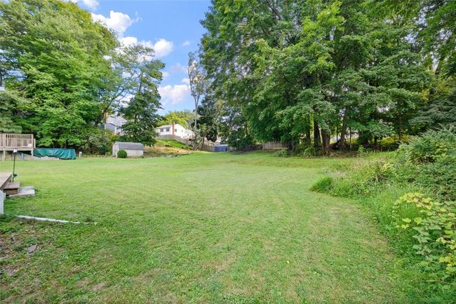 View of yard with a storage shed | Image 30