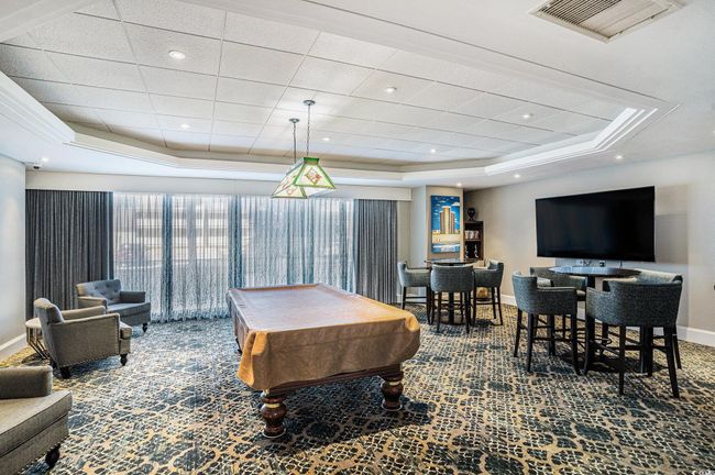 Rec room featuring a raised ceiling, pool table, and carpet floors | Image 24