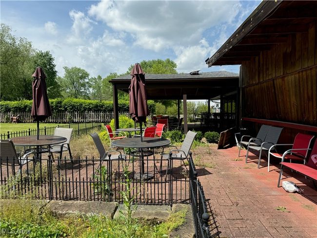 View of patio with outdoor dining space | Image 45