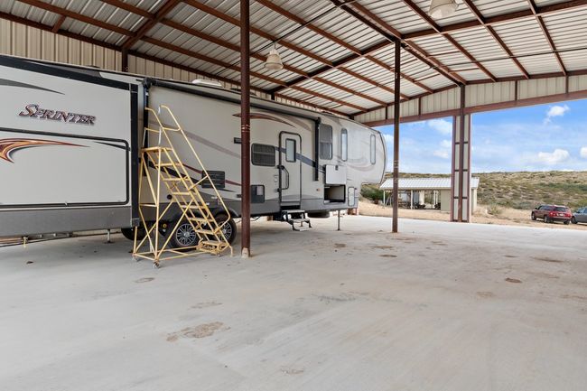 Garage with a carport | Image 30
