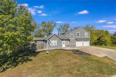 Front of property featuring a front yard and a garage | Image 3