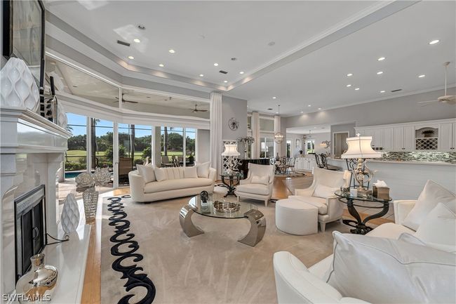 Open living space with custom marble remote controlled fireplace and newer gas logs | Image 5