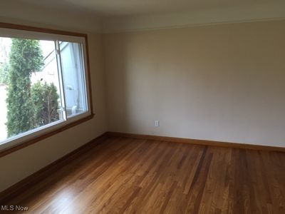 Empty room with wood-type flooring | Image 2