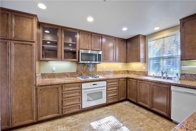 Sunlit kitchen provides beautiful views from the easterly facing window | Image 9
