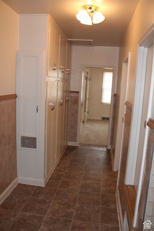 Hallway featuring a wainscoted wall and baseboards | Image 13