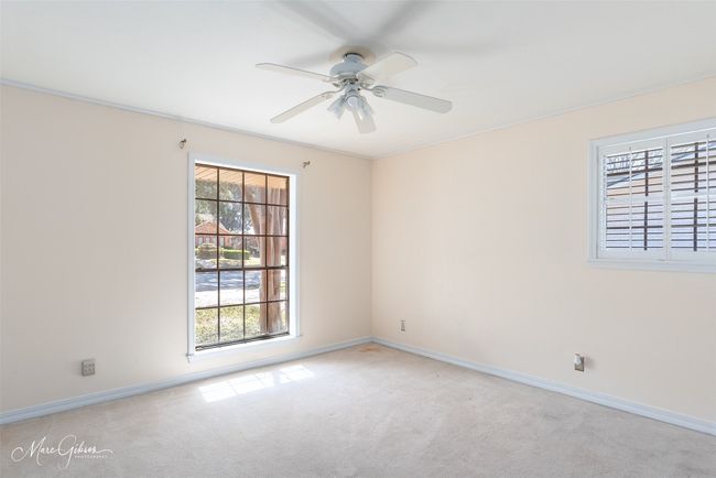 Empty room featuring baseboards, carpet floors, and a ceiling fan | Image 13