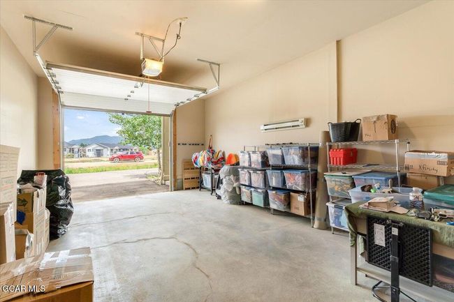 Heated Garage. Extra wide for storage on the side. And extra tall--- can pull in an SUV with a roof box on top. | Image 22