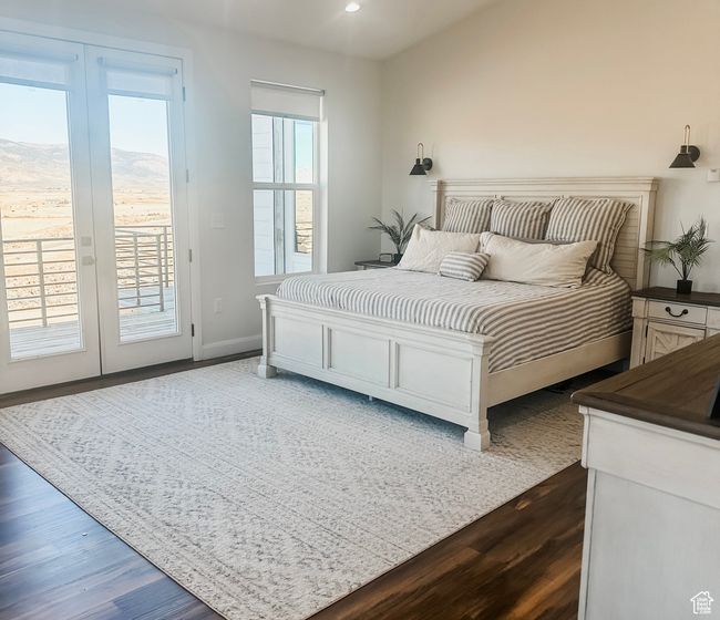 Bedroom with dark wood-style floors, access to exterior, baseboards, and recessed lighting | Image 15