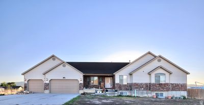 View of front of home with accurate photo of lawn and a garage | Image 2