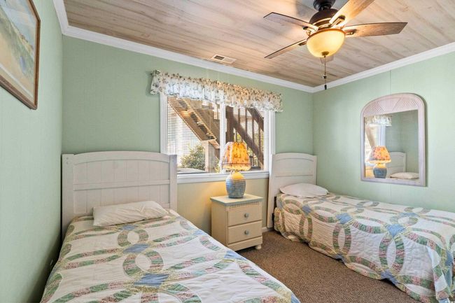 Carpeted bedroom featuring ornamental molding, ceiling fan, and wooden ceiling | Image 18