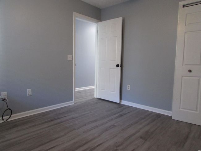 Bedroom with LVP flooring. | Image 14