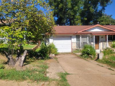 View of front of house with a porch and a garage | Image 2