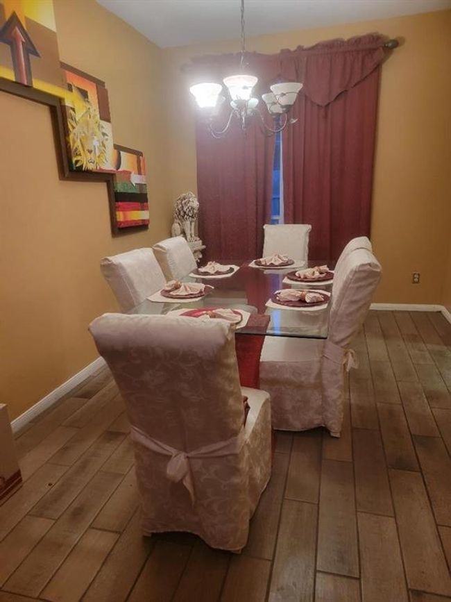 The dining room leads straight into the kitchen, great for hosting holiday meals or casual dinners | Image 5