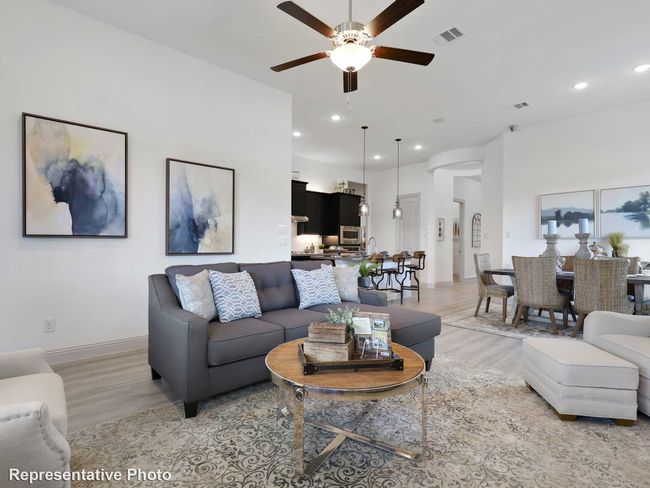 Living room with recessed lighting, visible vents, light wood finished floors, and ceiling fan | Image 6