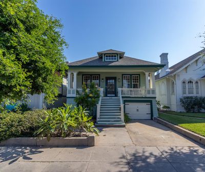 1520 25th Street, circa 1922, stunning craftsman-style with garage & full "Galveston" basement, solar panels & recent roof (both with requisite WPI8s), saltwater pool & spa and outdoor kitchen. Located on the only residential esplanade in Galveston running through a historic district. | Image 1