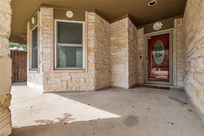 Covered front porch is the perfect place to sip tea and wave at the neighbors. | Image 4