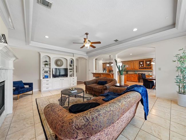 Cozy living room bathed in natural light. | Image 15