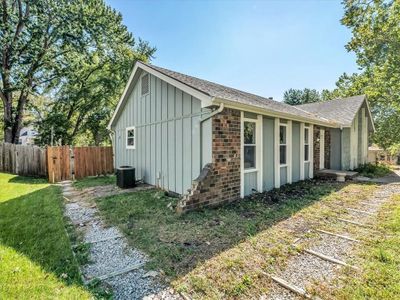 View of side of home with a yard | Image 2