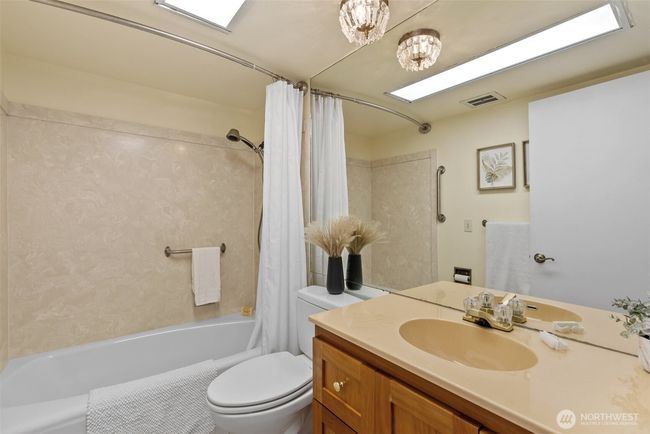 Full size hall bath with refreshed vanity and ceramic tile flooring. | Image 20