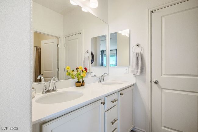 Full bathroom #3 upstairs with double vanity and a sink | Image 27