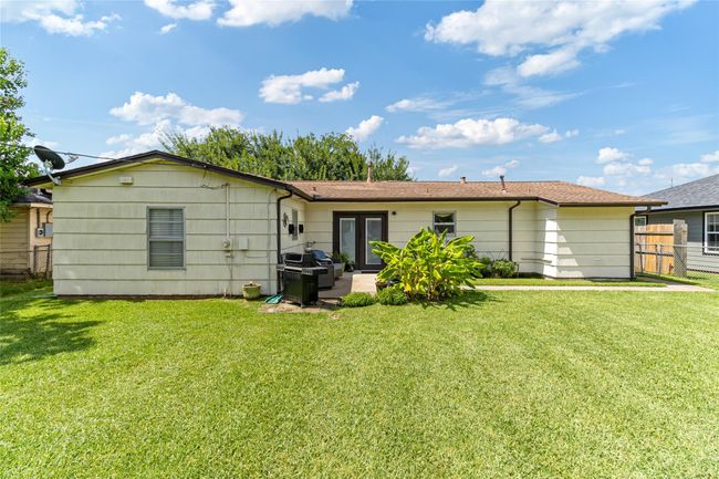Rear view of the home featuring a roof replacement completed in October 2017 & peace of mind with a transferable foundation warranty through D-Squared. | Image 23