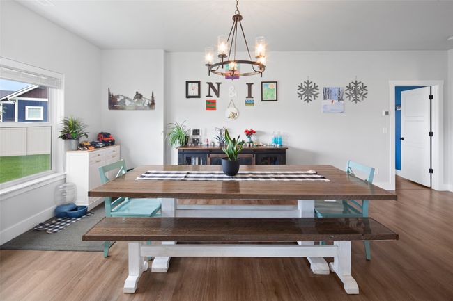 Open dining room offers room for many to join. | Image 27