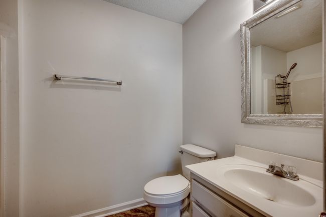 Bathroom with vanity and a textured ceiling | Image 26