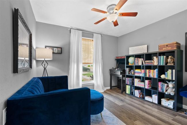 Versatile first bedroom perfect for a office or study space. | Image 7