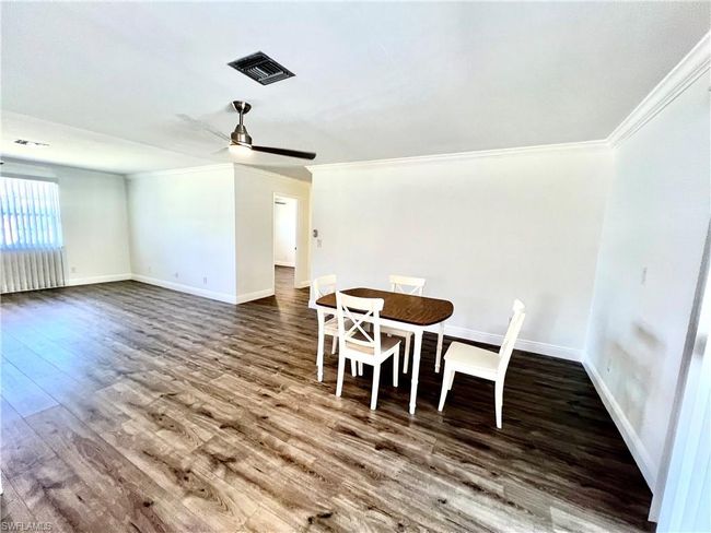 Dining area with LUXURY VINYL PLANK FLOORS. | Image 18