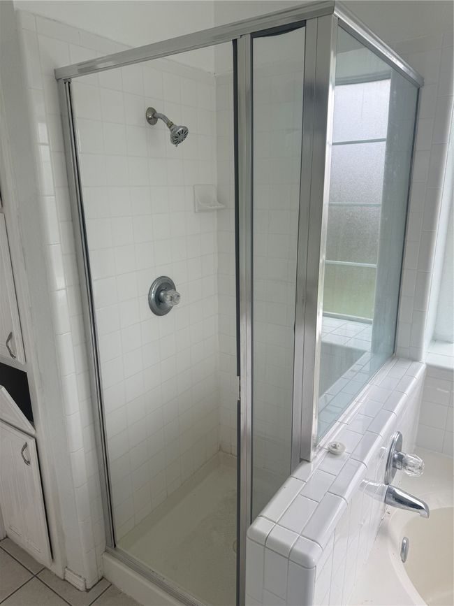 Full bathroom with a shower stall, a garden tub, and tile patterned flooring | Image 14
